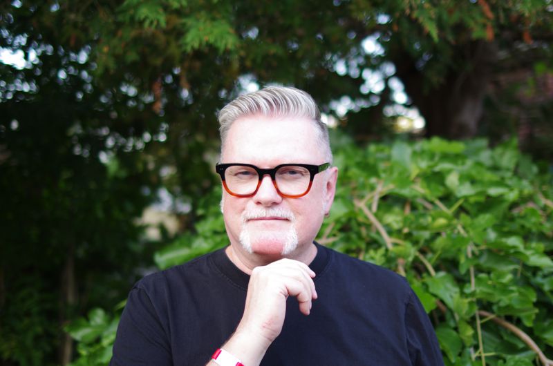 David Moulton, Registered Psychotherapist, standing in front of vegetation
